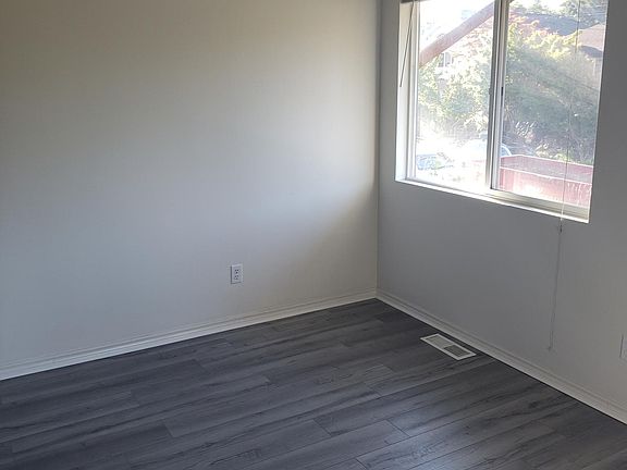 Dining room area with brand new luxury vinyl plank foors and new light fixture