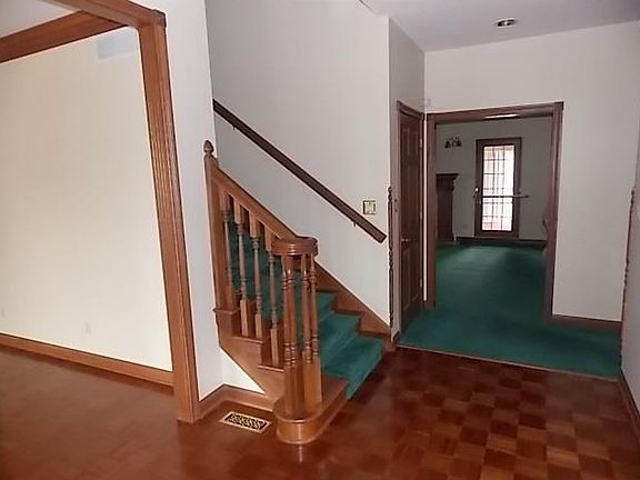 Entry. Two story 8 X 15 entry with cherry staircase.