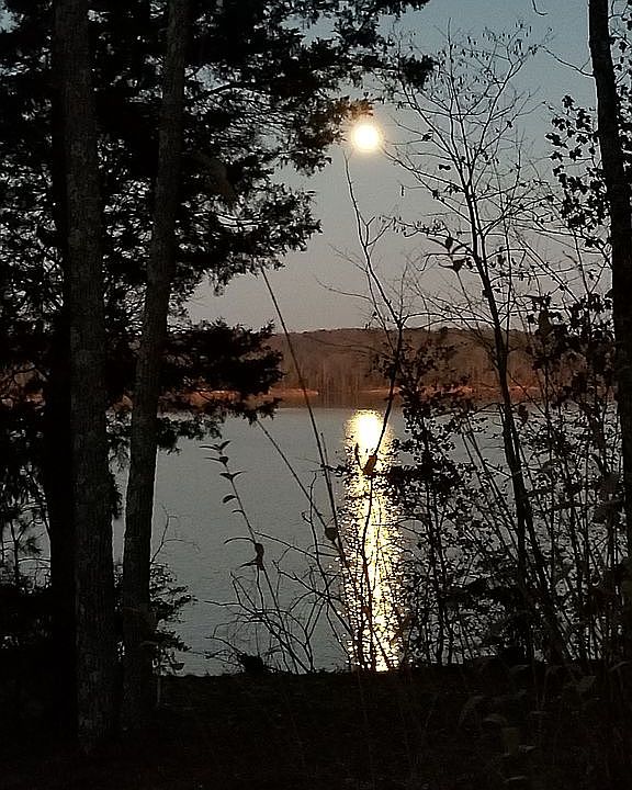 view of full moon over lake