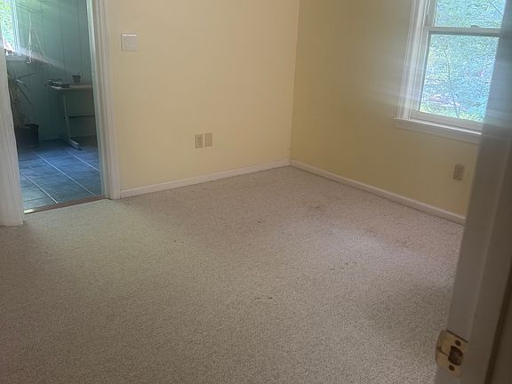 2nd bedroom with spacious closet and door to bonus sunroom