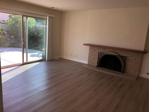 Family connected to kitchen bar seating and direct access to the backyard.