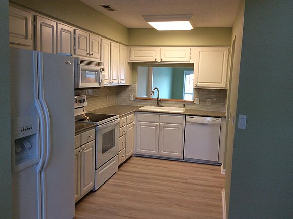 Kitchen and living area behind the cutout