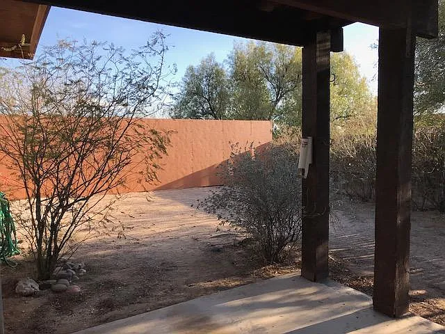 Backyard with 7 foot privacy wall.