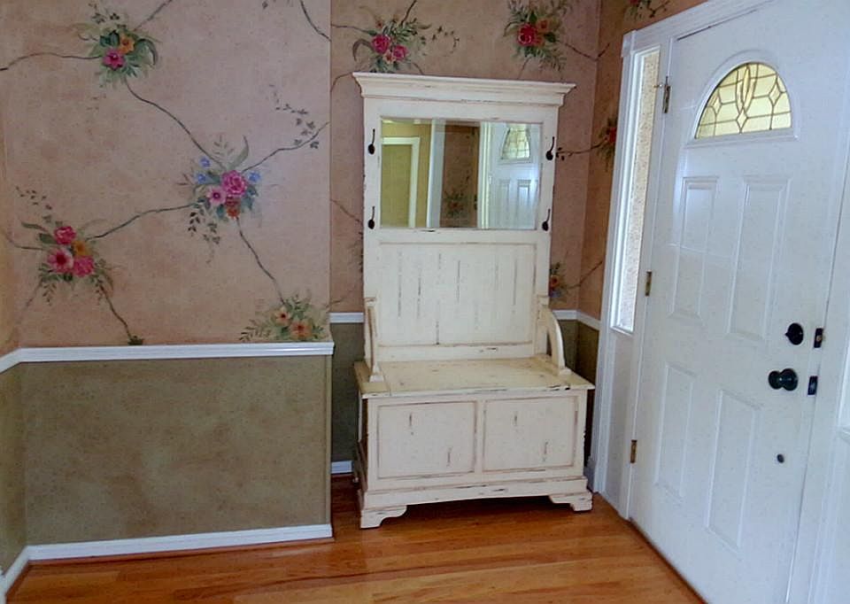 Wood foyer with custom hand painted accents.  Just beautiful!