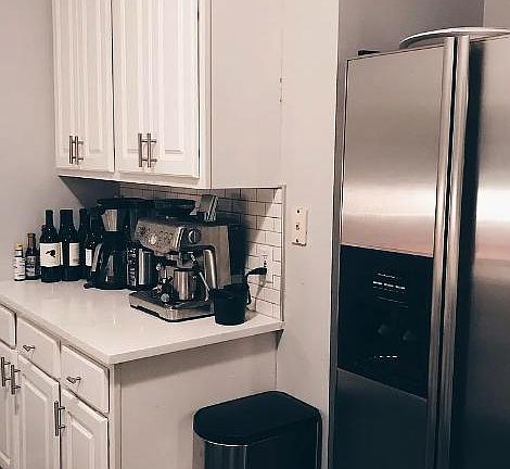 Stainless steel appliances with ample counter and cabinet space.
