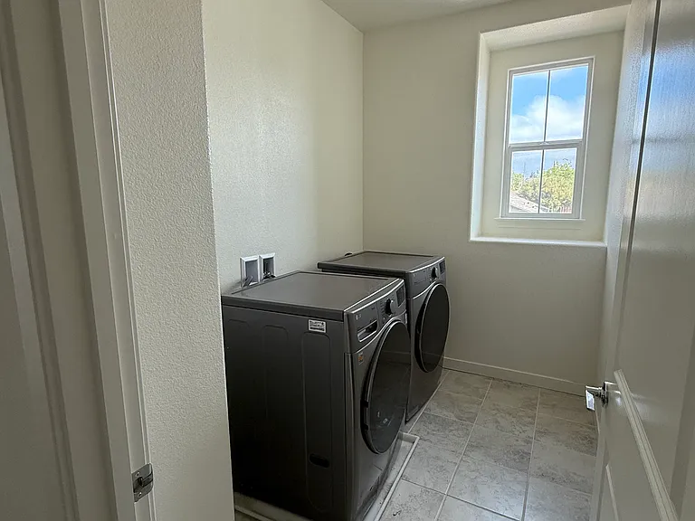Upstairs laundry room with washer and dryer