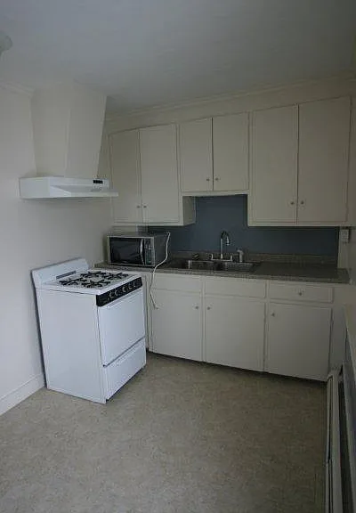 Kitchen, view #1. Please note that the range and hood have been updated to a Samsung double-oven.
