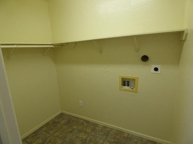 Closet with laundry hook ups.