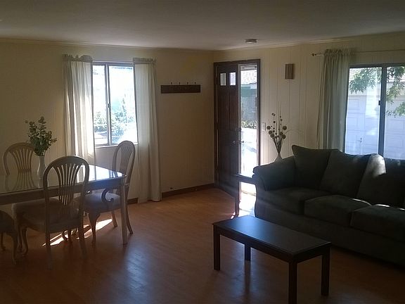 First floor "great room" includes open kitchen, dining, and