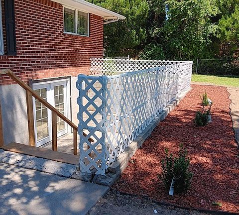 New stairs and lattice fencing. Stairs to unit will be white.