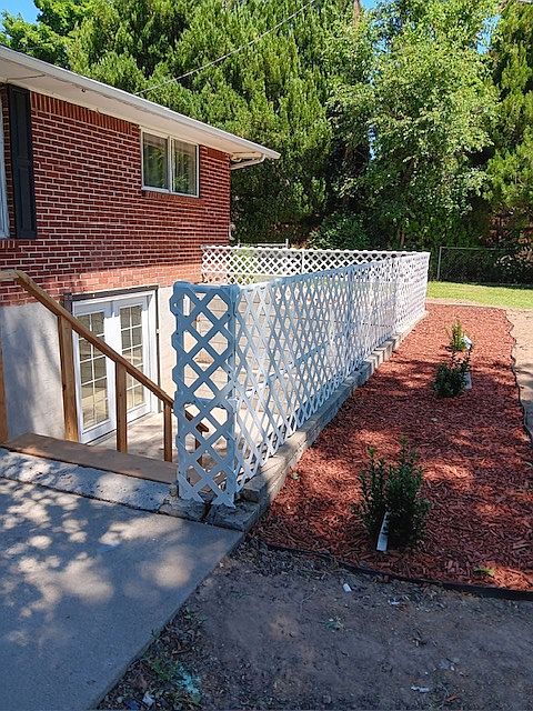 New stairs and lattice fencing. Stairs to unit will be white.