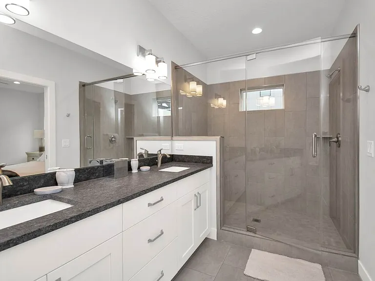 Master bathroom with large walk in shower and his and hers sinks