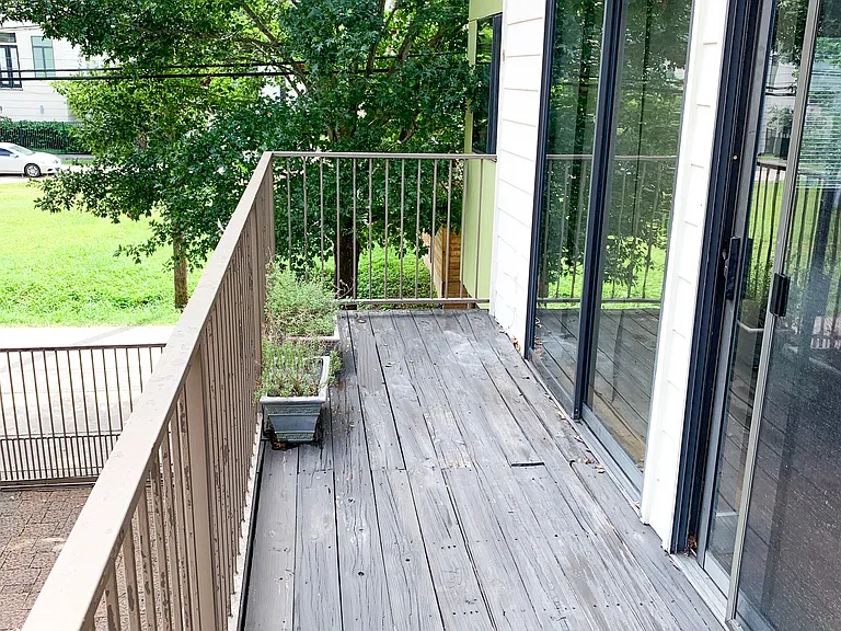 Spacious balcony can fit a grill and table and chairs