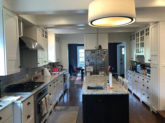 Kitchen with granite, newer appliances, island eating