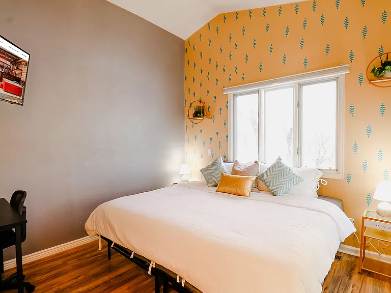 Plush Paradise: A restful haven adorned with sufficient pillows, ensuring a cozy and supportive environment for a perfect night's sleep or a leisurely day in.