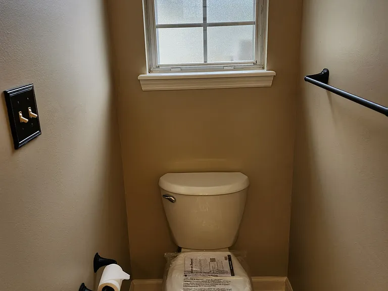 New commode and nice/small window for great light. Numerous towel racks.