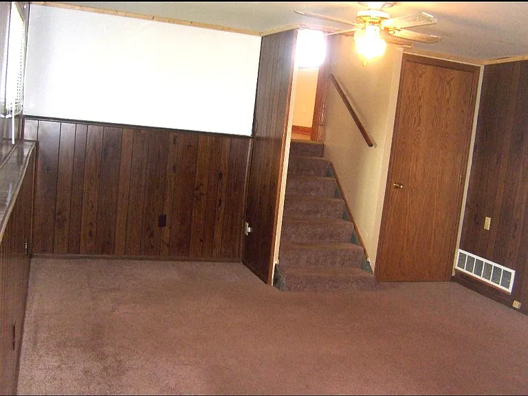 Family room/utility room leading to living room.