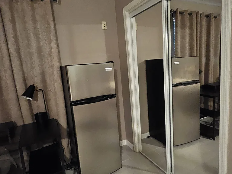 Mirror closet doors at entrance to walk-in closet.