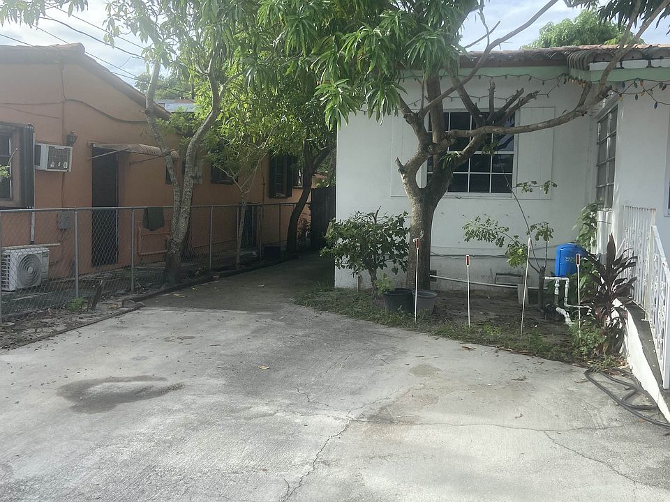 Private side entrance in-front of two reserved parking spots