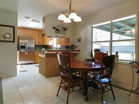 Breakfast area overlooks spacious lot.