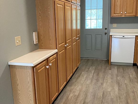 Lots of cabinets in this galley kitchen!