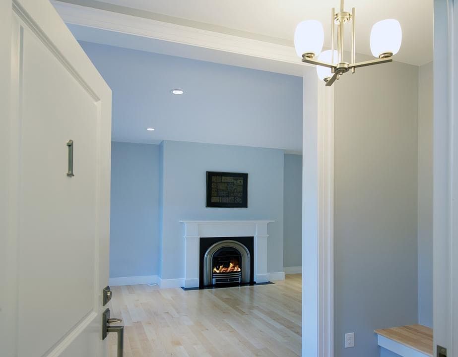 Entry into unit foyer, living room; built-in bench ; gas fireplace