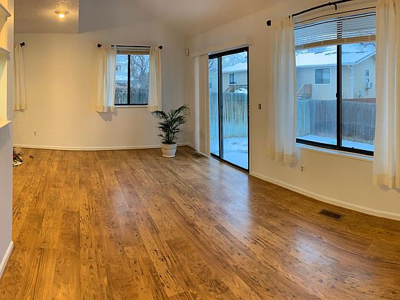 Living room with wood floors (image distorted by angle)