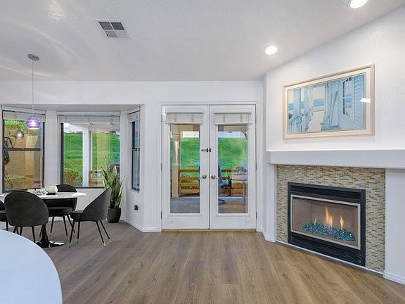 Kitchen, dining, gas fireplace, french door to patio