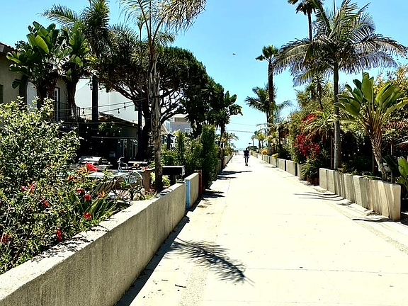 Walk street in front of building just steps to the beach & short walk to the pier