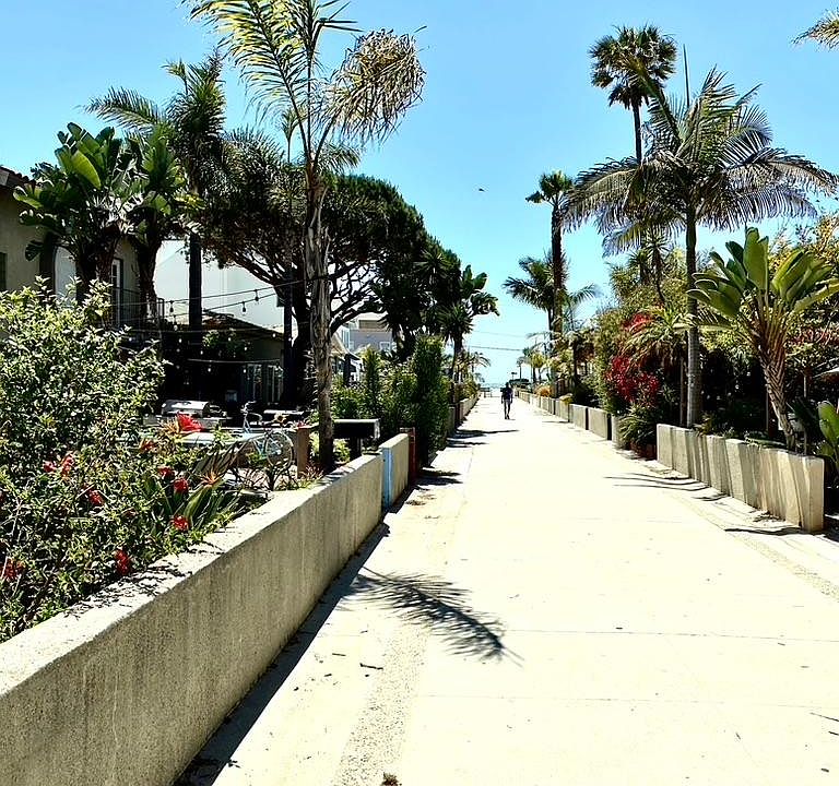 Walk street in front of building just steps to the beach & short walk to the pier
