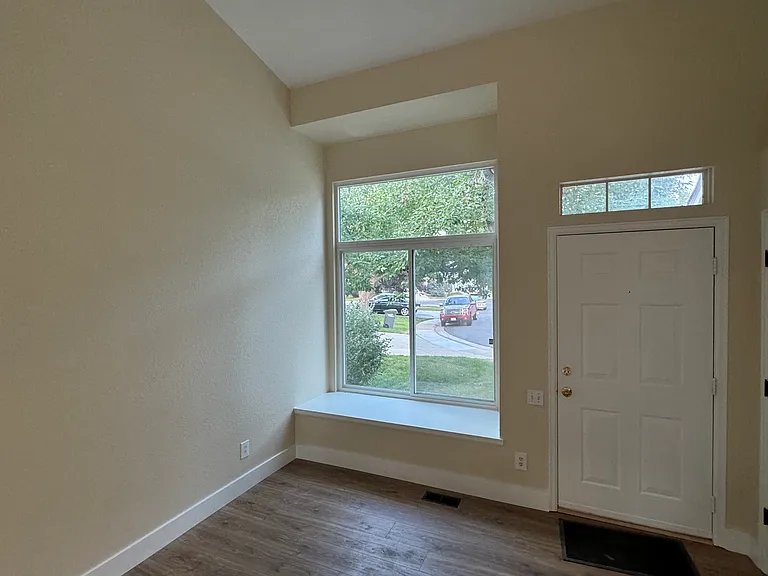 Inside the front door.