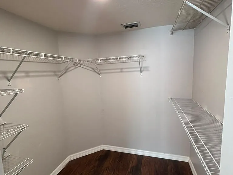 Walk-in closet in primary bedroom