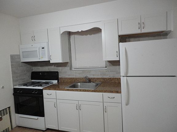 New cabinets, microwave and back splash, Just painted and professionally cleaned.