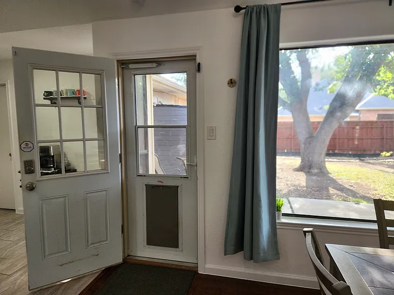 Doggie Door exit to fenced backyard off dining room/kitchen. Oversized backyard window.