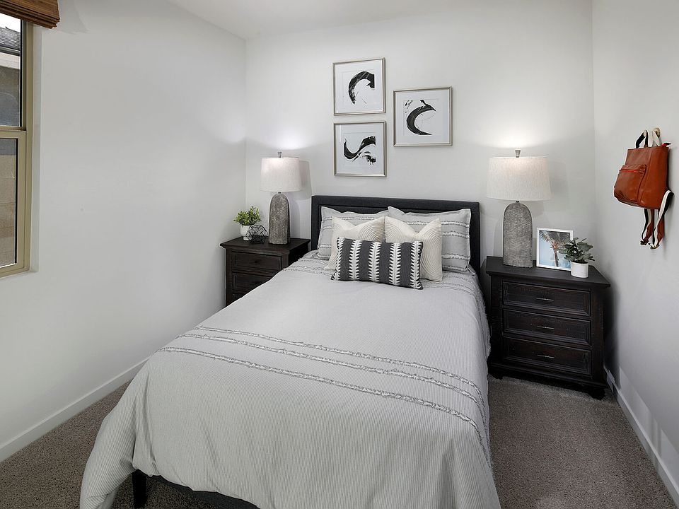 Secondary bedroom in Carson floorplan modeled at The Enclave on Olive.