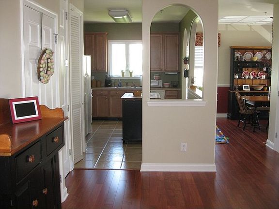 Foyer with hardwood floors.  Open floorplan ideal for entertaining.