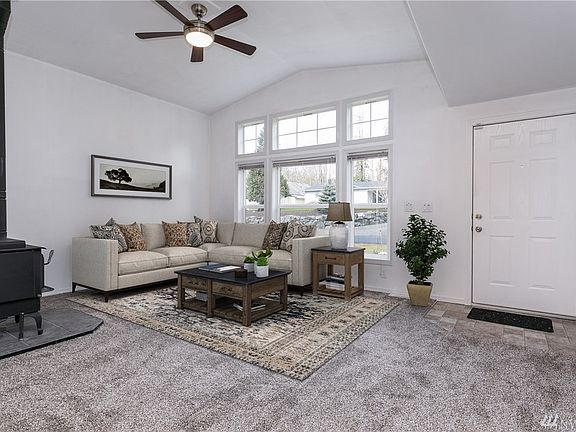 Wood burning fireplace & vaulted ceilings (virtually staged)