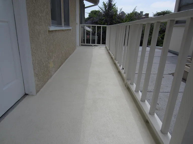 Balcony. 1st door is the main entrance. 2nd door is an additional entrance for room 3 of 3.