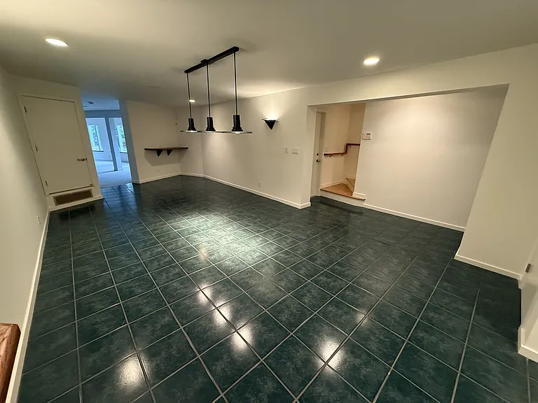 Downstairs hallway and loft area is a game room with space for a Billard table.