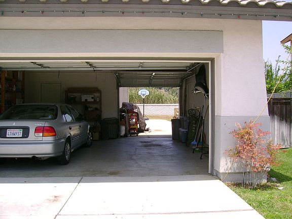 Access to backyard with drive-thru garage.
