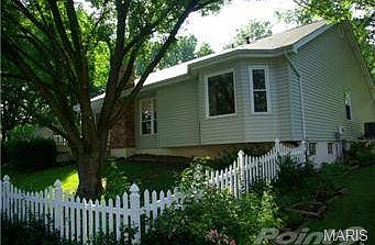 Vinyl white picket fencing.