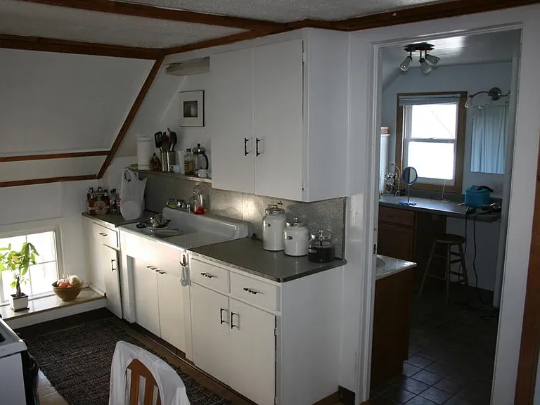Nostalgic Vintage Kitchen. Flooring replaced with Luxury Vinyl Plank in May 2024.