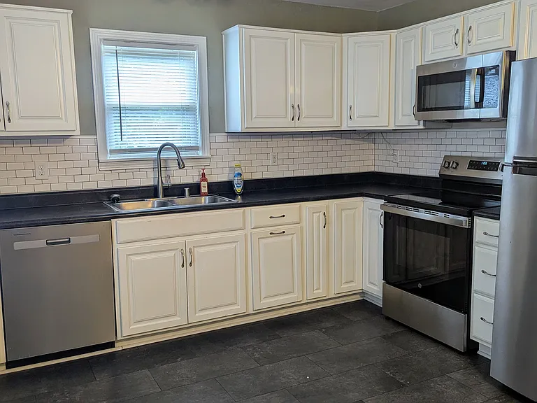 A large fully updated kitchen with a bonus dining area and pantry. All new appliances were added in 2025.