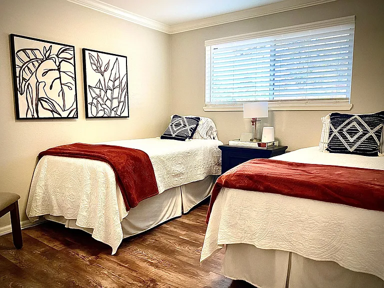Large secondary bedroom has room for two twins and nightstand