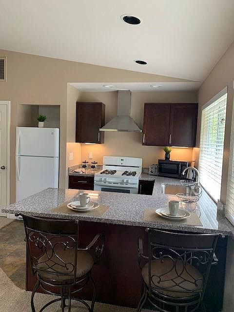 Fully furnished, remodeled kitchen and eating bar. Includes, microwave, dishes, pots, pans, etc.