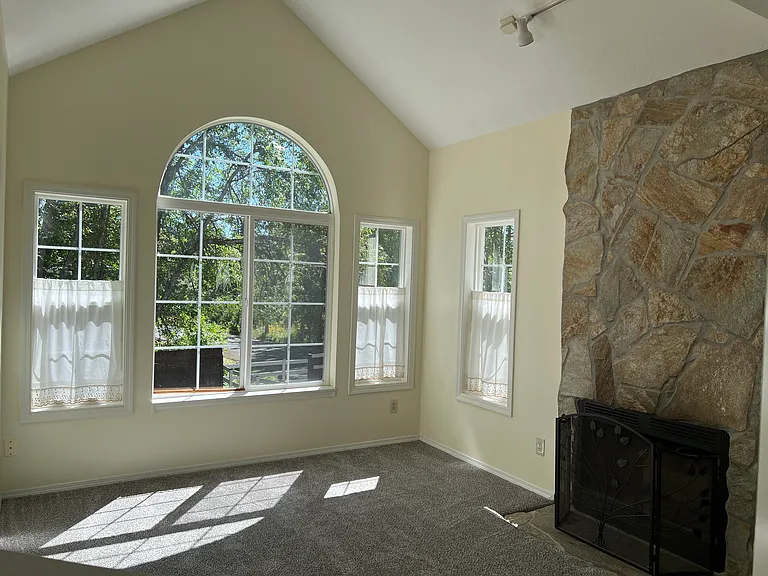 Back parlor with picture window facing greenspace
