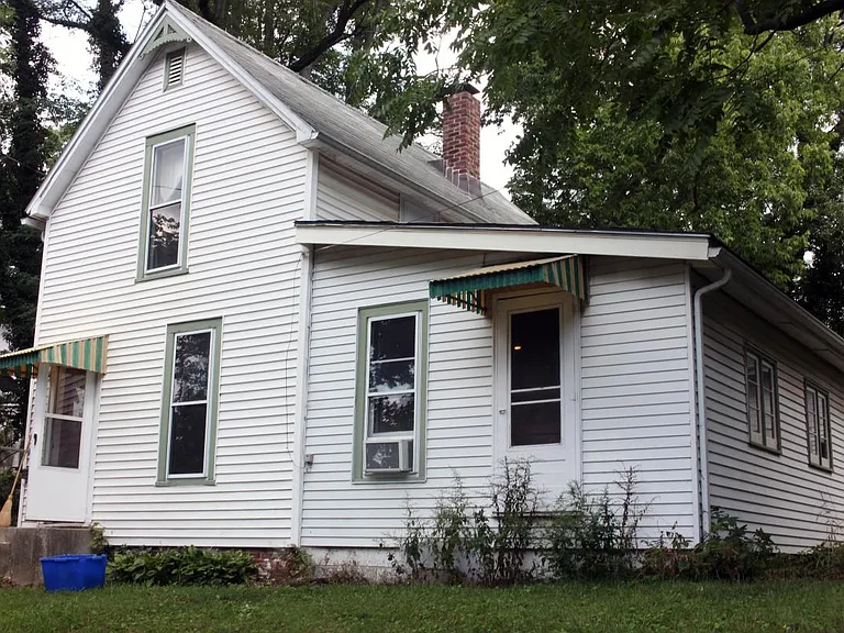 Front of house, from street (can't see hill or rock garden b