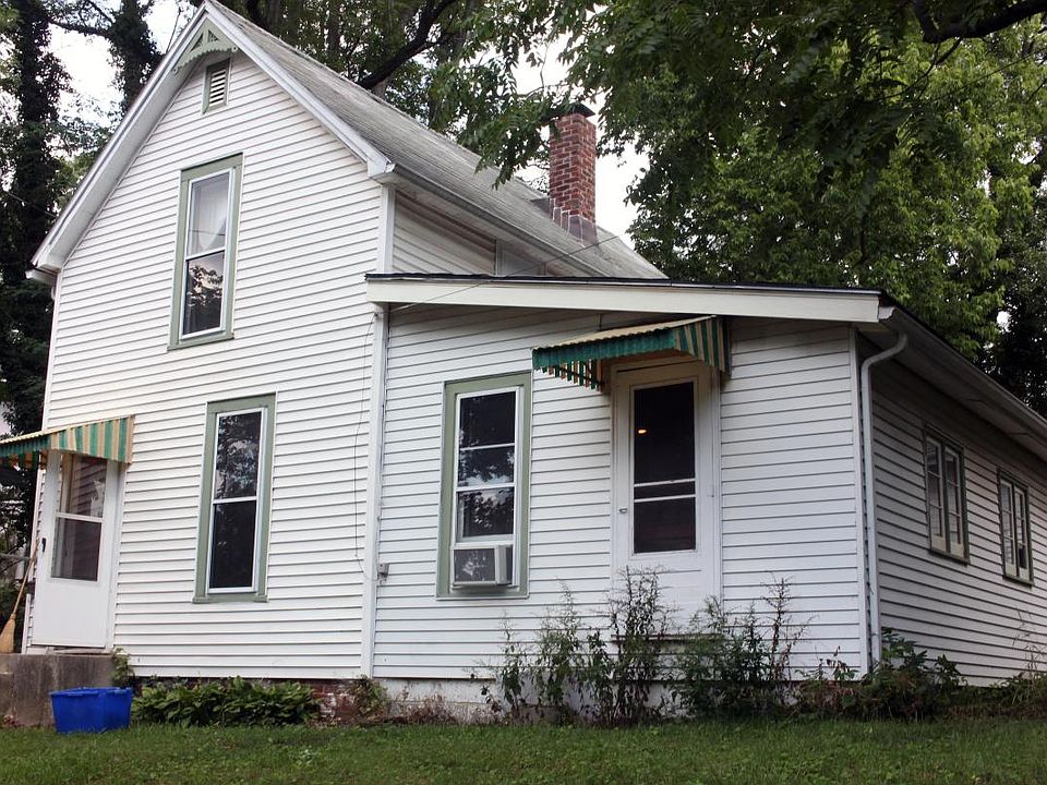 Front of house, from street (can't see hill or rock garden b