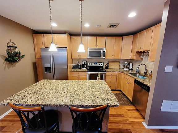 Kitchen with Granite Countertops and Stainless Steel Appliances