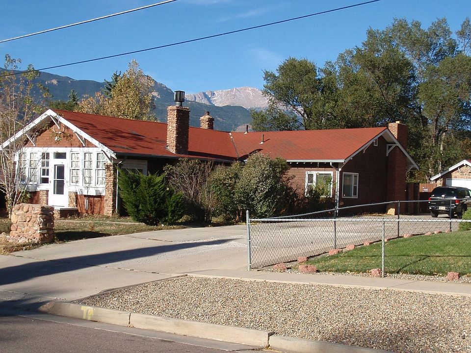 The apartment is the back part of this large house on the west side.